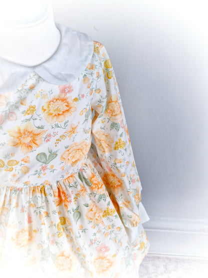 3 years. White Miss Quality dress with orange and peach floral print and Peter Pan collar