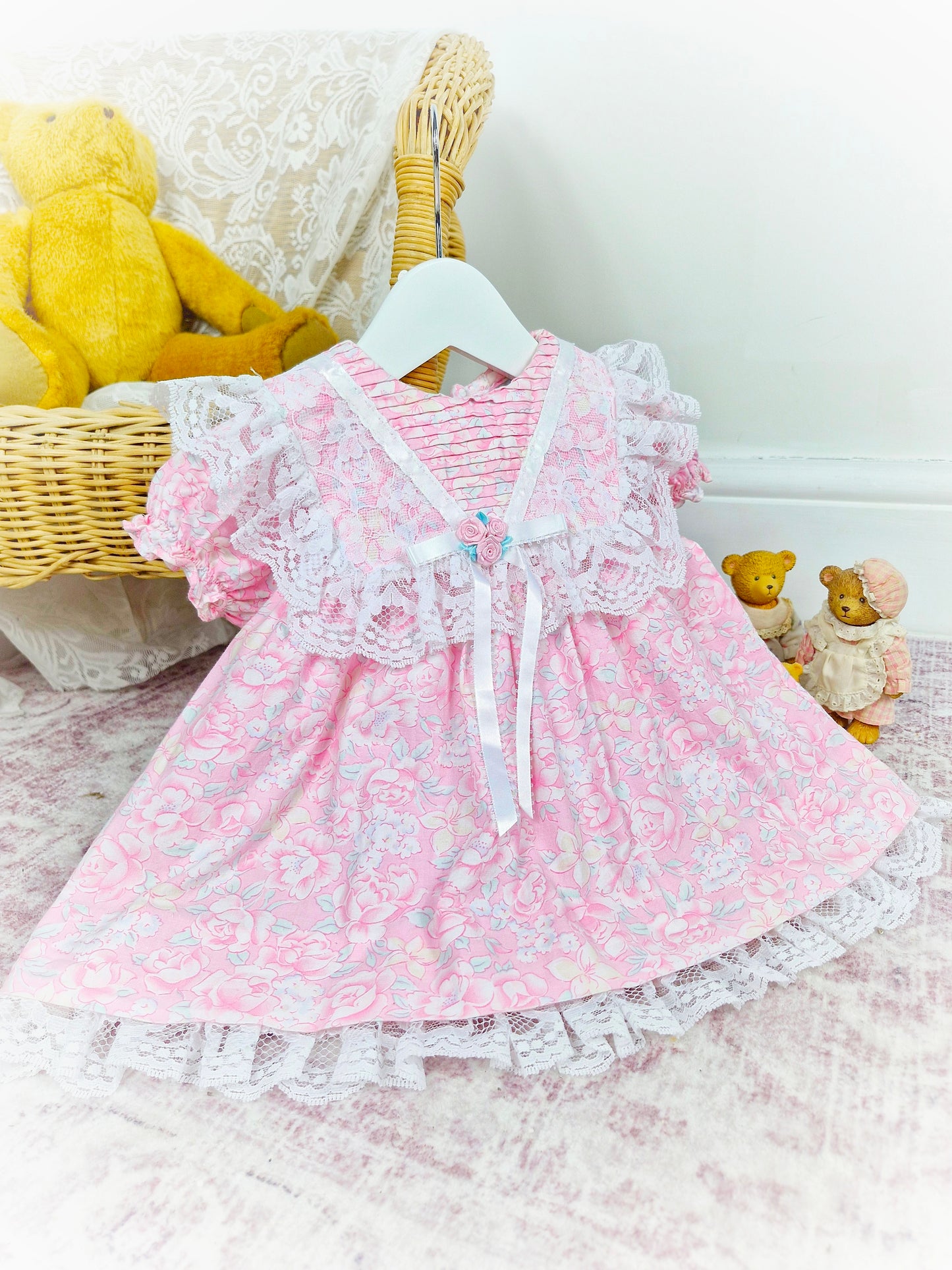 12 months. Pink floral vintage dress with white satin ribbon and lace