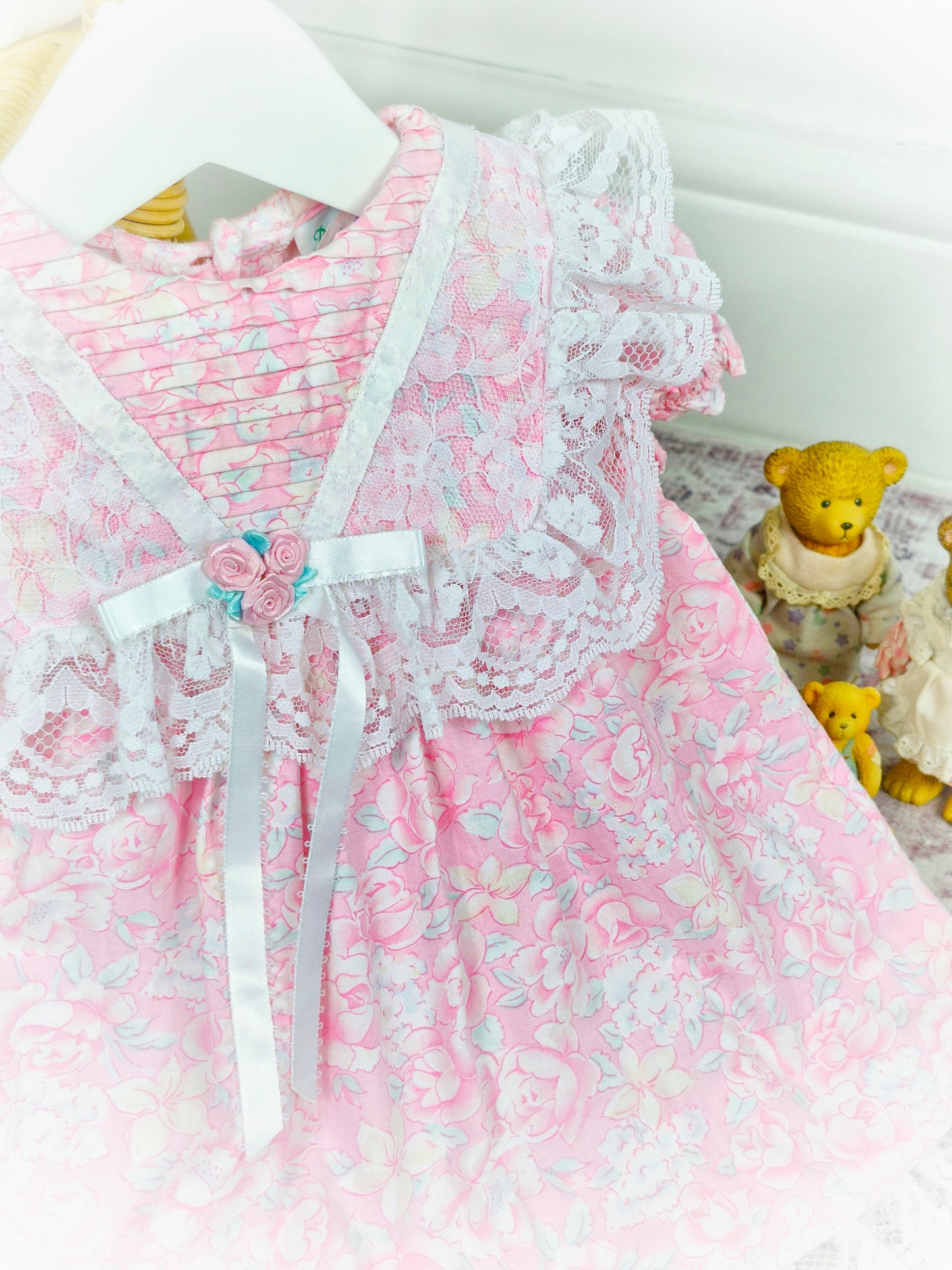 12 months. Pink floral vintage dress with white satin ribbon and lace