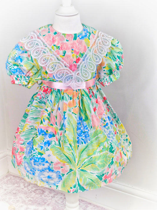 3-4 years. Watercolour printed vintage dress from Cuddle Teen with pink ribbon and large bib