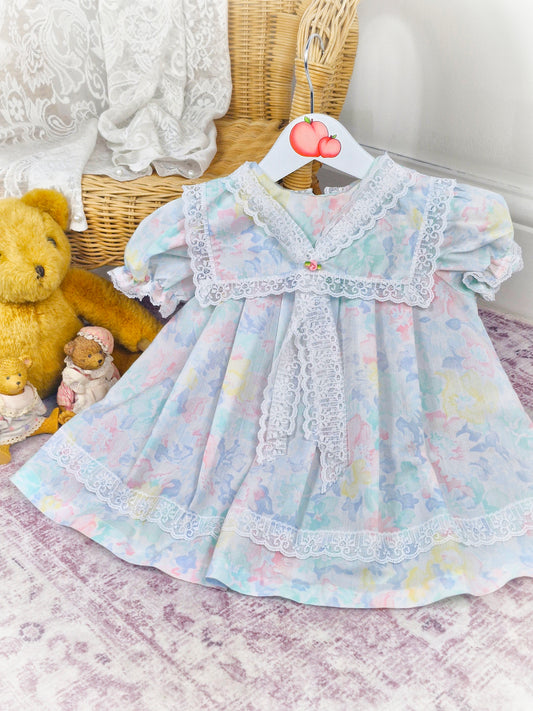 12-18 months. Pastel vintage dress by Evy with white lace collar, bib trim and hem
