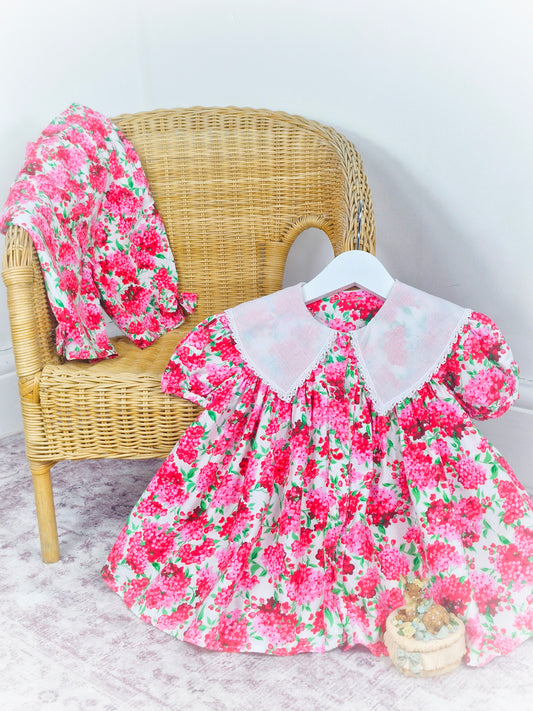 2-3 years. Two piece set from Plum Pudding Ltd. Dress and bloomers, pink and green floral pattern with large white collar