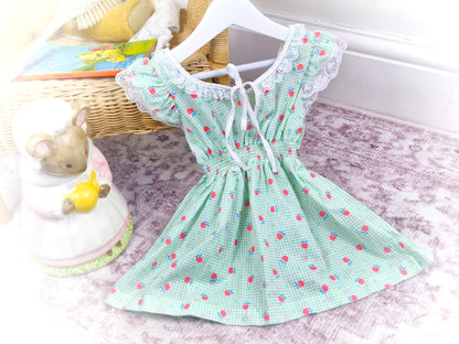 2 years. Green and white checked vintage dress with smocking, apple print and lace trim