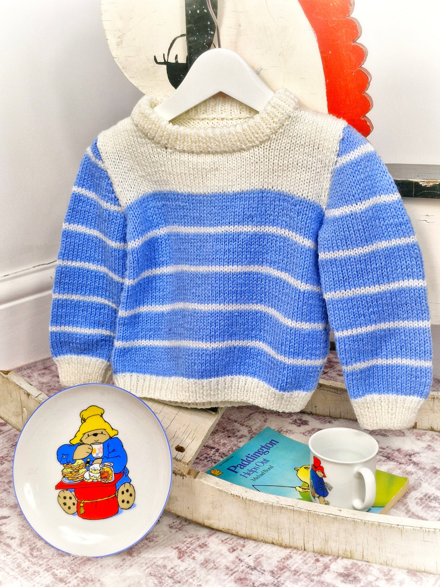 2 years. Blue and white striped knitted jumper