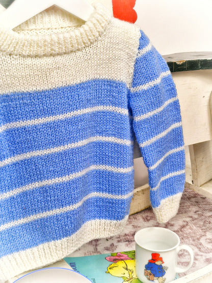2 years. Blue and white striped knitted jumper