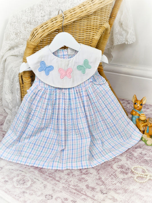12-18 months. Pastel seersucker sleeveless vintage dress with white bib and butterflies