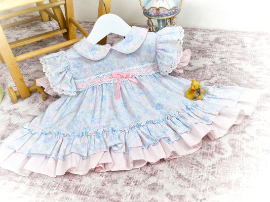 9-12 months. Pastel floral vintage dress from New York Kids, flutter sleeves, collar and pink satin ribbon