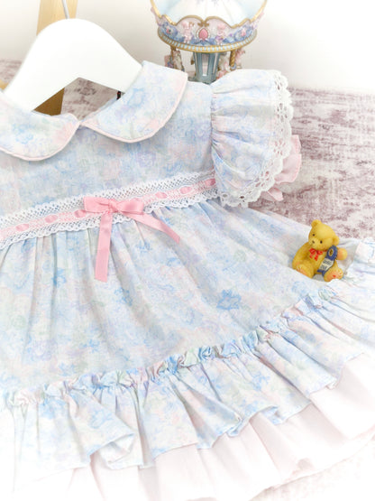 9-12 months. Pastel floral vintage dress from New York Kids, flutter sleeves, collar and pink satin ribbon