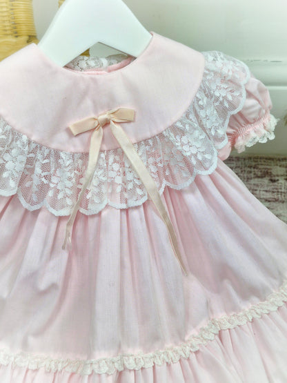 9 months. Pink vintage Bryan with white lace details, puff sleeves and satin bow