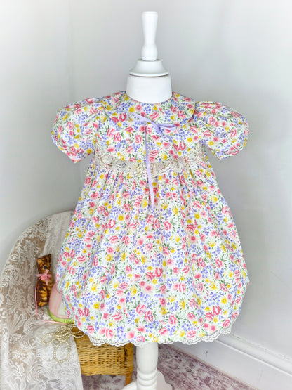 2-3 years. Floral vintage dress from Jeffrey B with puff sleeves, white lace and lilac ribbon
