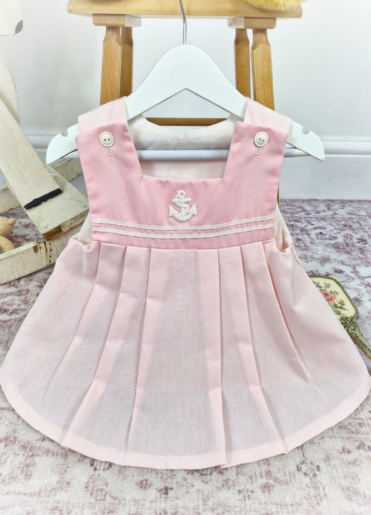 12-18 months. Pink sleeveless vintage dress with pleats and white details from Mothercare