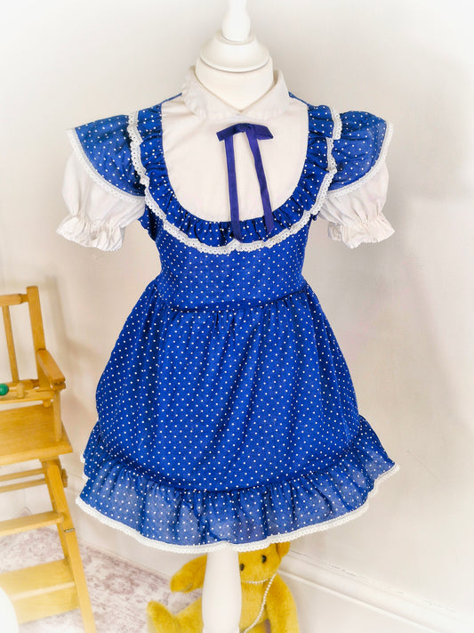 3-4 years. Navy vintage dress with white polka dots, sleeves and chest with ruffles. Winnie the Pooh brand