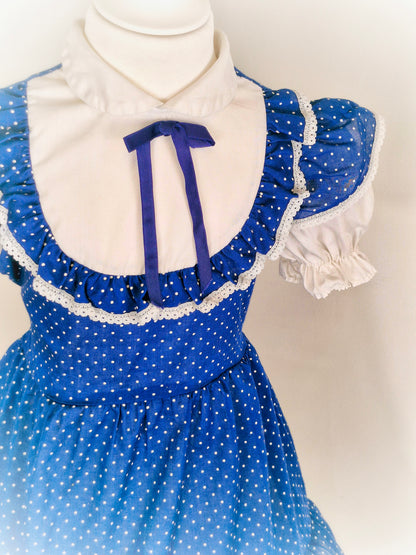 3-4 years. Navy vintage dress with white polka dots, sleeves and chest with ruffles. Winnie the Pooh brand
