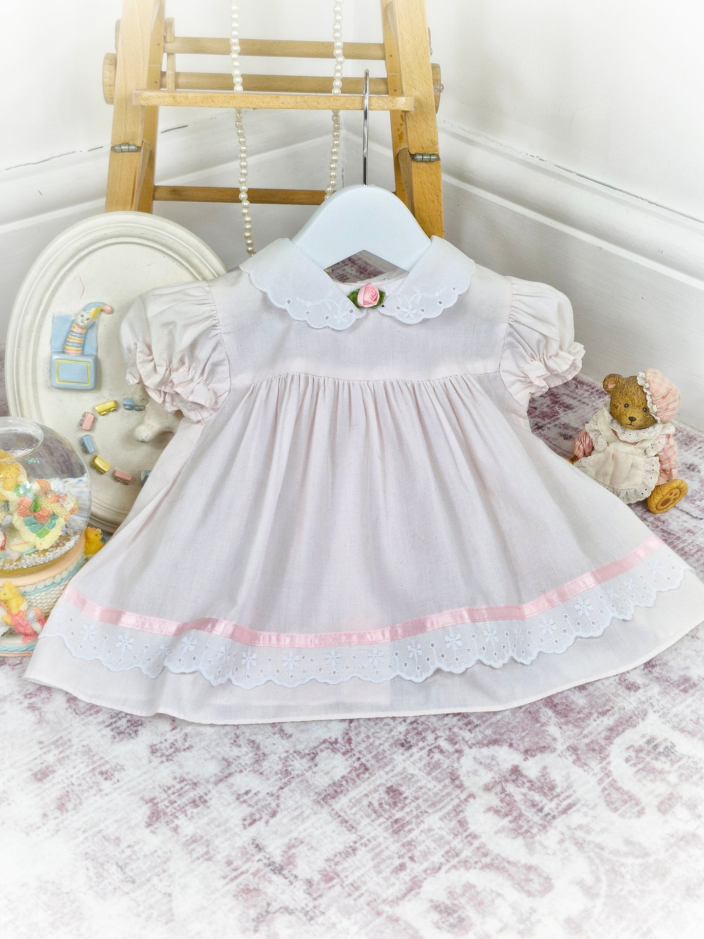 6-9 months. Light pink and white vintage dress from Bright Future with pink rosette and satin ribbon