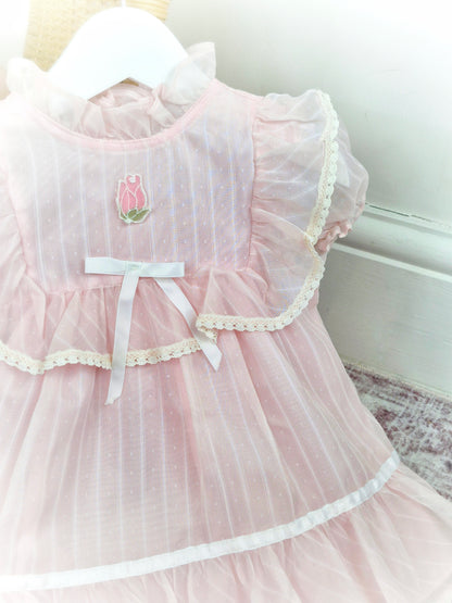 12-18 months. Light pink sheer vintage dress with lace, ruffles and white satin bow