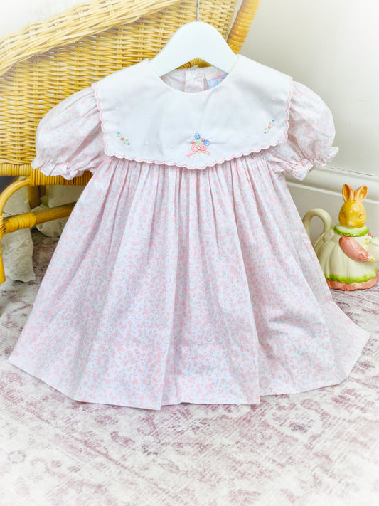 2 years. Floral Petit Ami with smocking, white bib and embroidered floral details