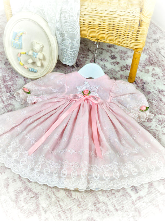 9 months. Pink vintage dress with delicate floral appliques and a ribbon bow