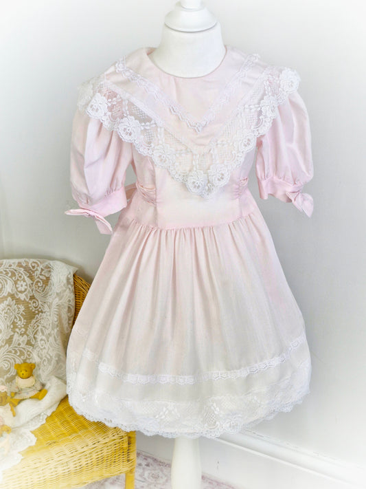 5 years. Light pink vintage Jolene dress with large lace bib and hem