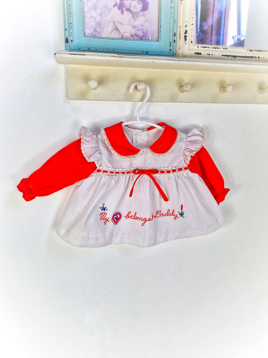 0-6 months. Red and white vintage dress with embroidered "my heart belongs to daddy"