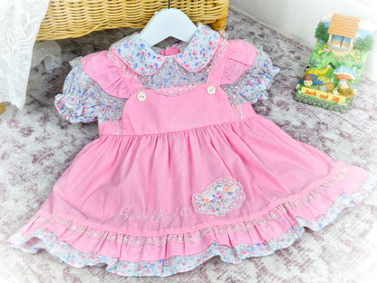 12 months. Pink vintage dress by Mayfair. Floral print, frills and embroidered "sweetheart"