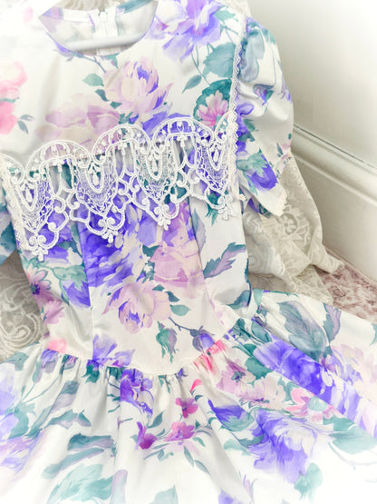 9-10 years. Vintage Jessica McClintock dress, white with purple floral designs, puff sleeves and lace bib details