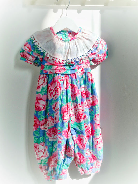 18 months. Pink and blue floral vintage romper with white bib by Baby Cary