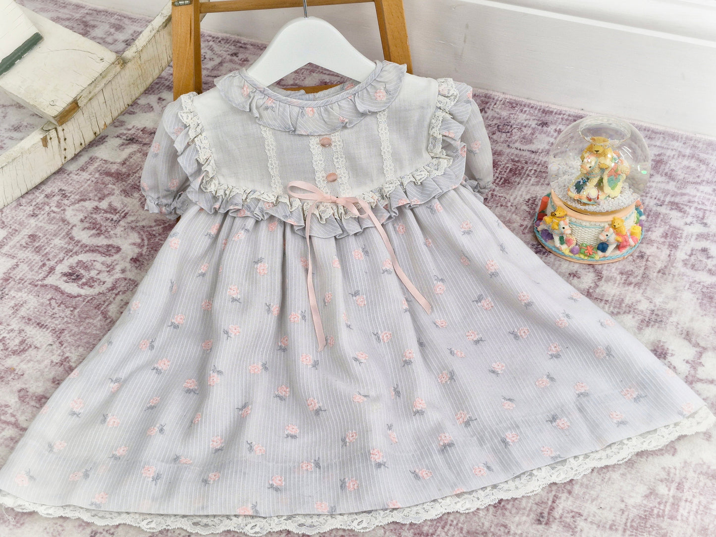 2-3 years. Vintage Peaches n' Cream dress, grey with pink flowers, buttons and ribbon
