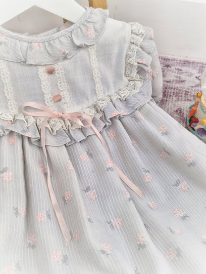 2-3 years. Vintage Peaches n' Cream dress, grey with pink flowers, buttons and ribbon