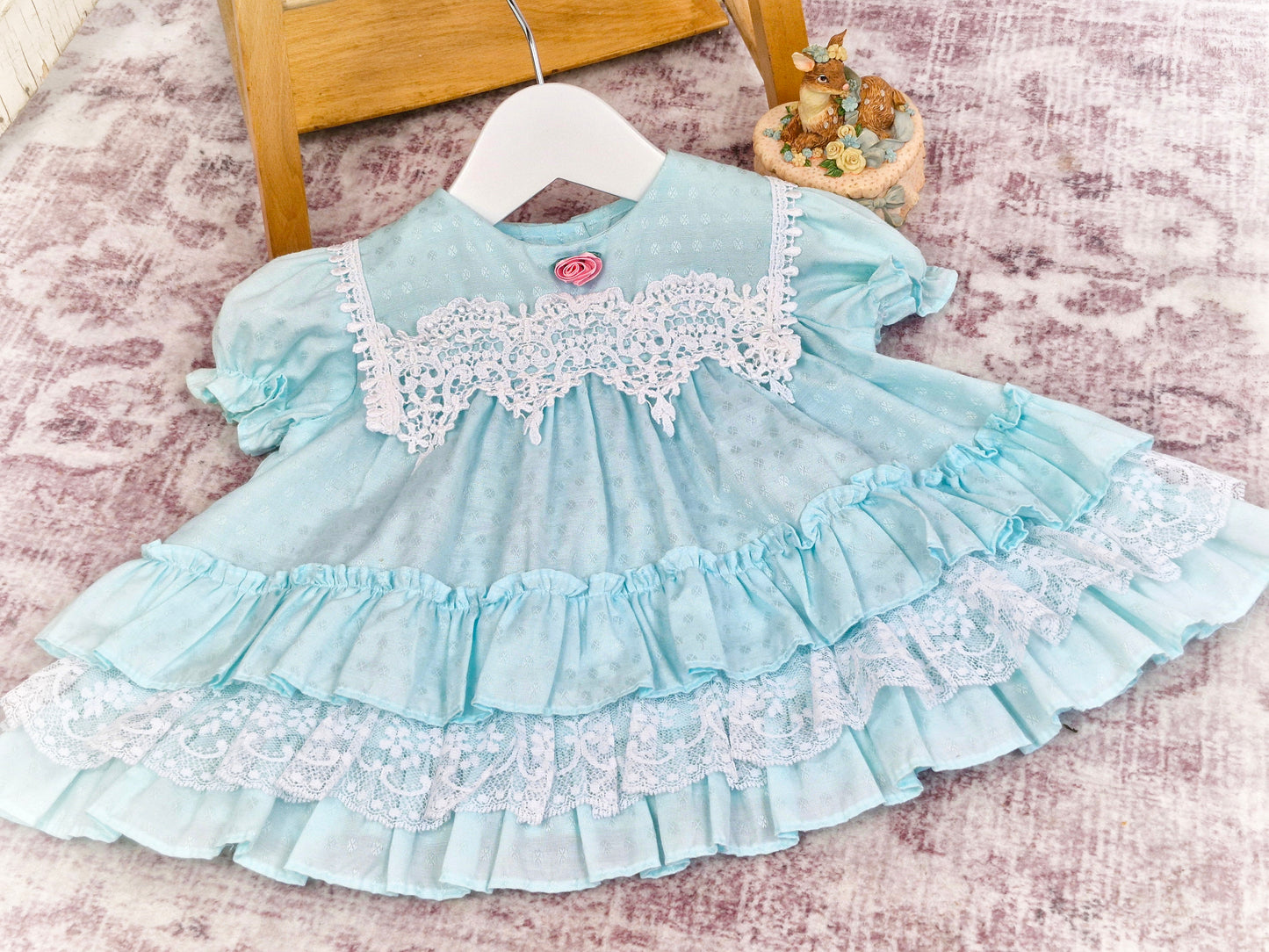 6-9 months. Mint frilly vintage dress from Allison Ann with white lace details, ruffles and pink rose