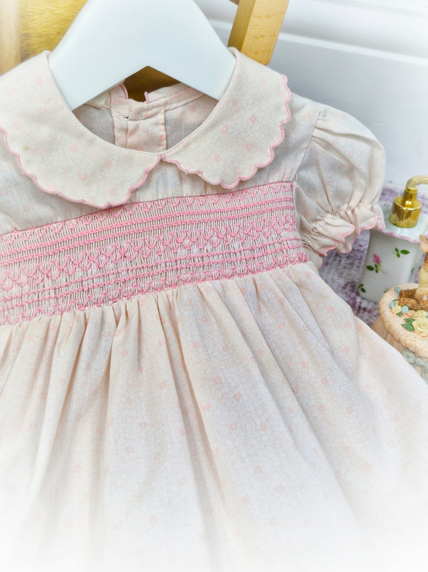 9-12 months. Pink vintage smocked dress with darker pink embroidery, scalloped collar and hem & puff sleeves