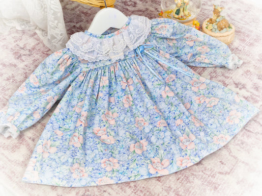 9-12 months. Blue floral vintage dress by Peaches n' Cream with white lace collar