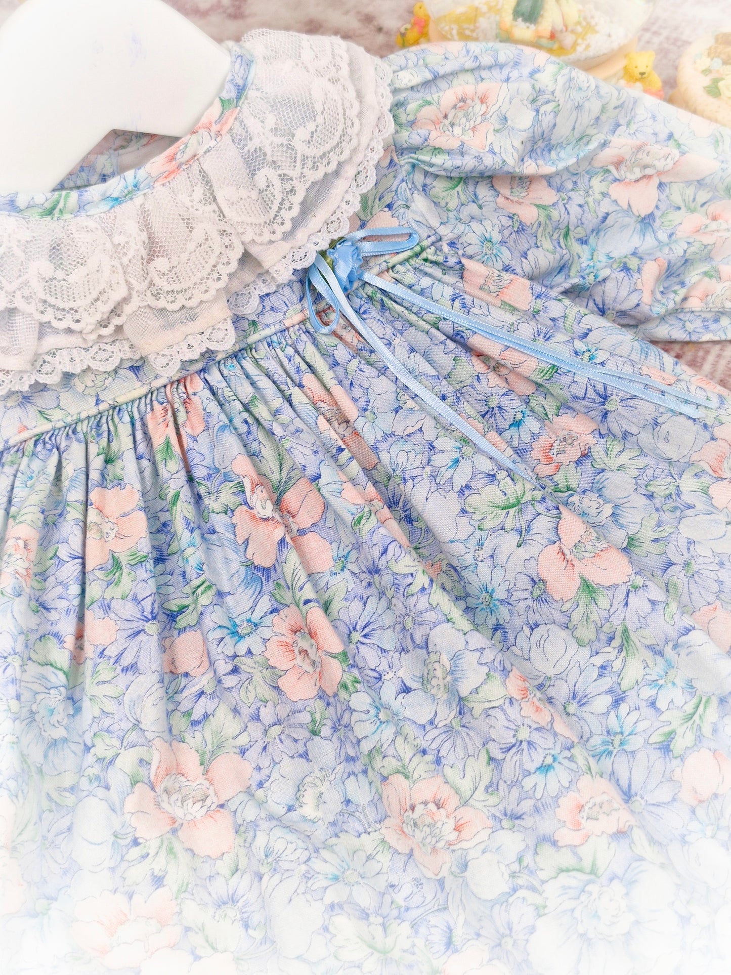 9-12 months. Blue floral vintage dress by Peaches n' Cream with white lace collar