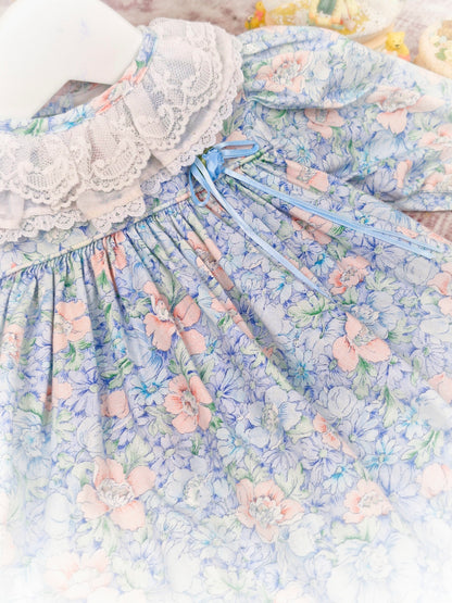 9-12 months. Blue floral vintage dress by Peaches n' Cream with white lace collar