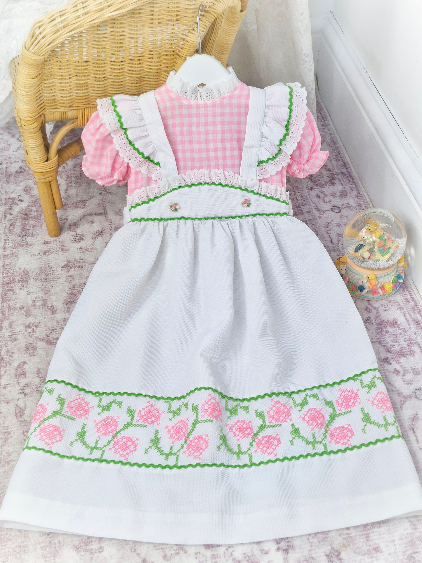 6-7 years. Vintage maxi dress, pink and white gingham with white waffle faux pinny, white lace dress and cross stitch flower designs