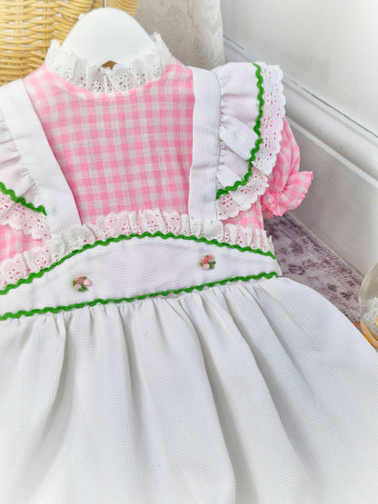 6-7 years. Vintage maxi dress, pink and white gingham with white waffle faux pinny, white lace dress and cross stitch flower designs
