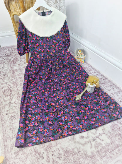 10 years. Vintage Rare Editions maxi dress, black with vibrant floral print with white bib