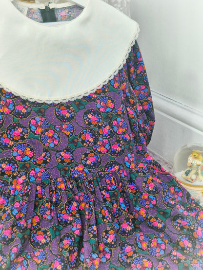 10 years. Vintage Rare Editions maxi dress, black with vibrant floral print with white bib
