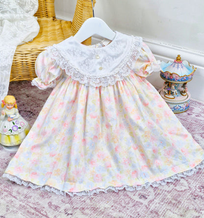 18-24 months/2 years. Watercolour pastel floral vintage dress with white lace bib and trim