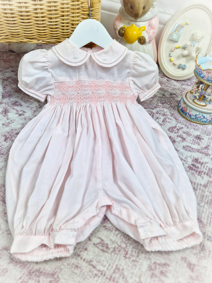 12 months. Light pink Petit Ami smocked romper with puff sleeves