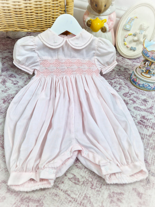 12 months. Light pink Petit Ami smocked romper with puff sleeves