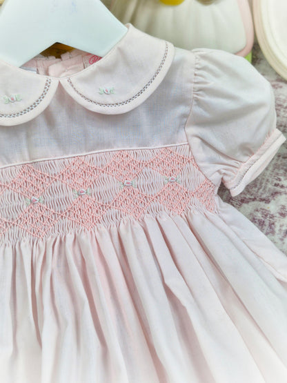 12 months. Light pink Petit Ami smocked romper with puff sleeves