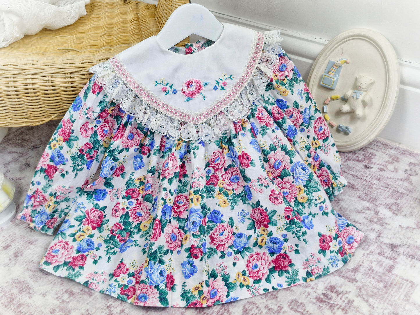 12-18 months. White vintage floral dress with large bib, embroidered with flowers and trimmed with lace