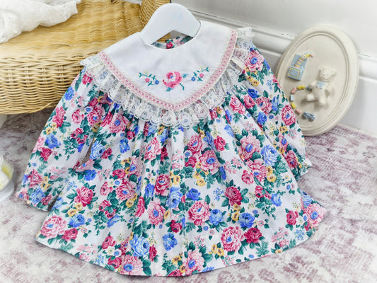 12-18 months. White vintage floral dress with large bib, embroidered with flowers and trimmed with lace