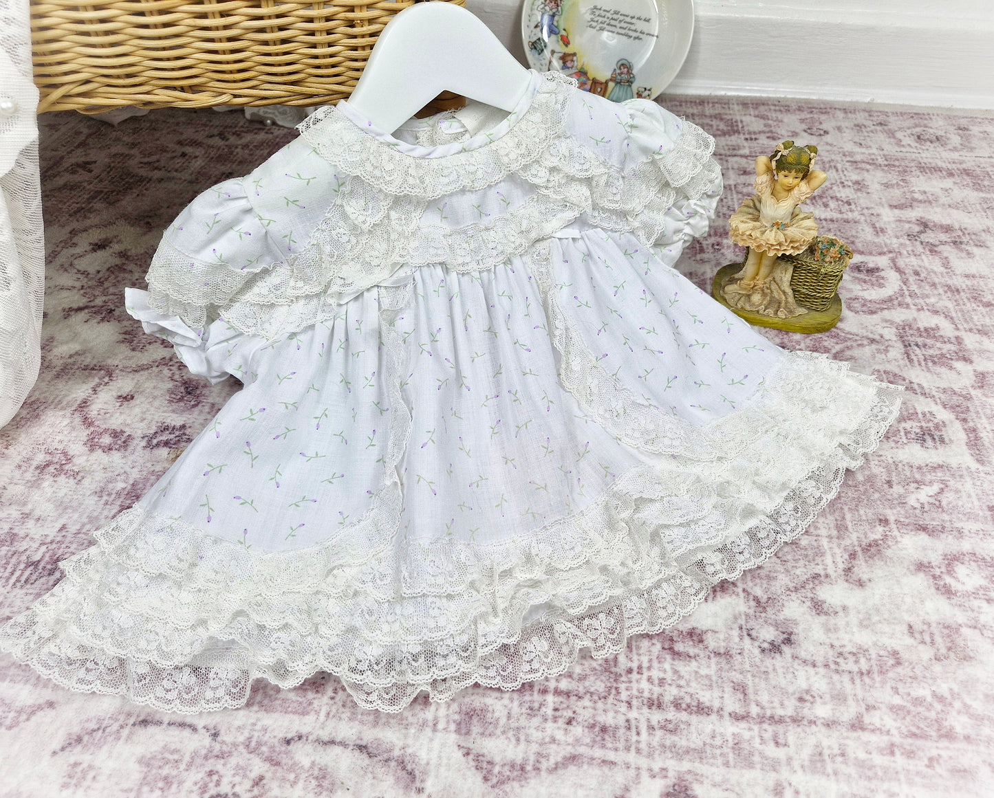 0-6 months. White vintage dress with lace trim and delicate floral print
