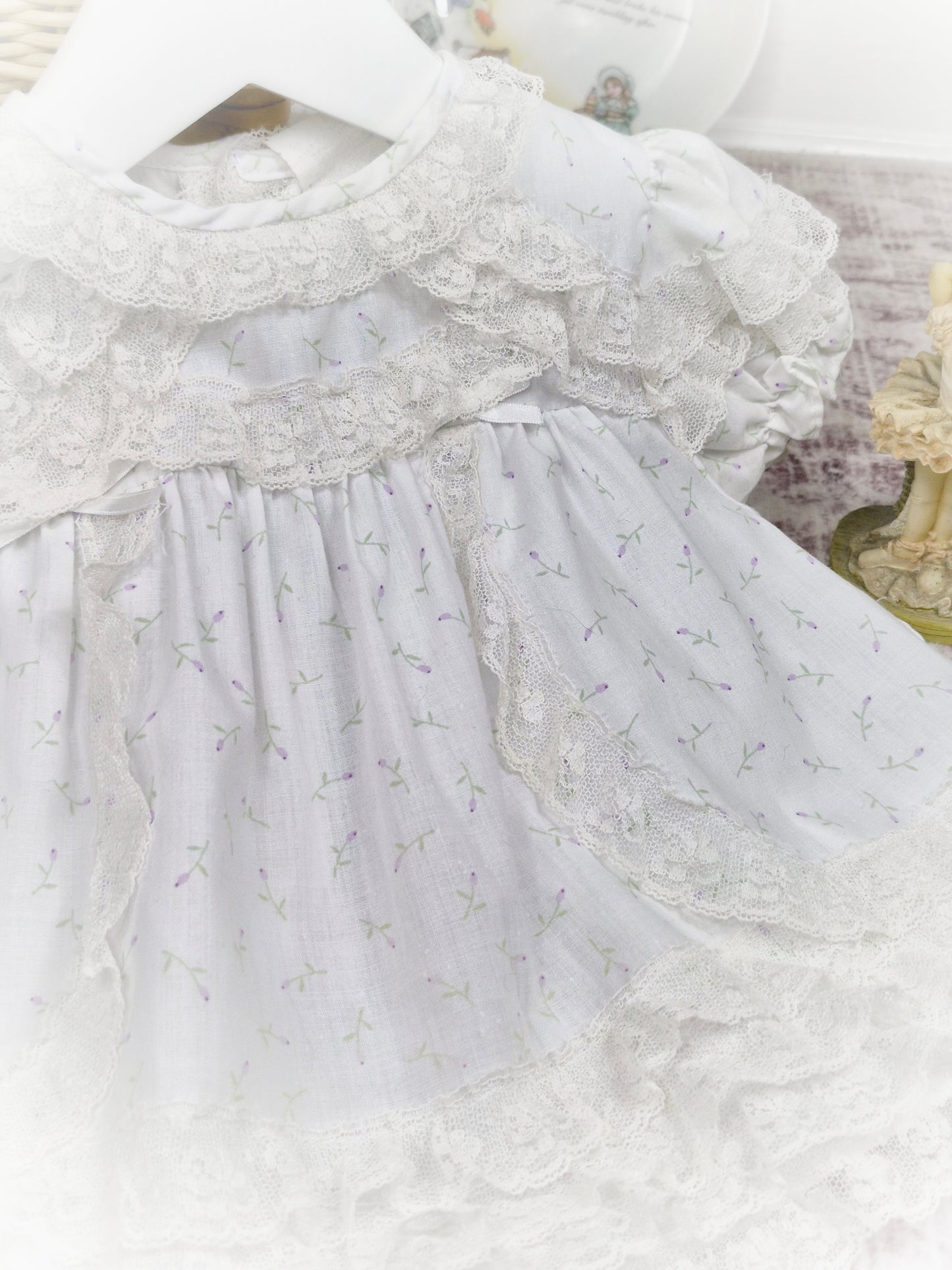 0-6 months. White vintage dress with lace trim and delicate floral print