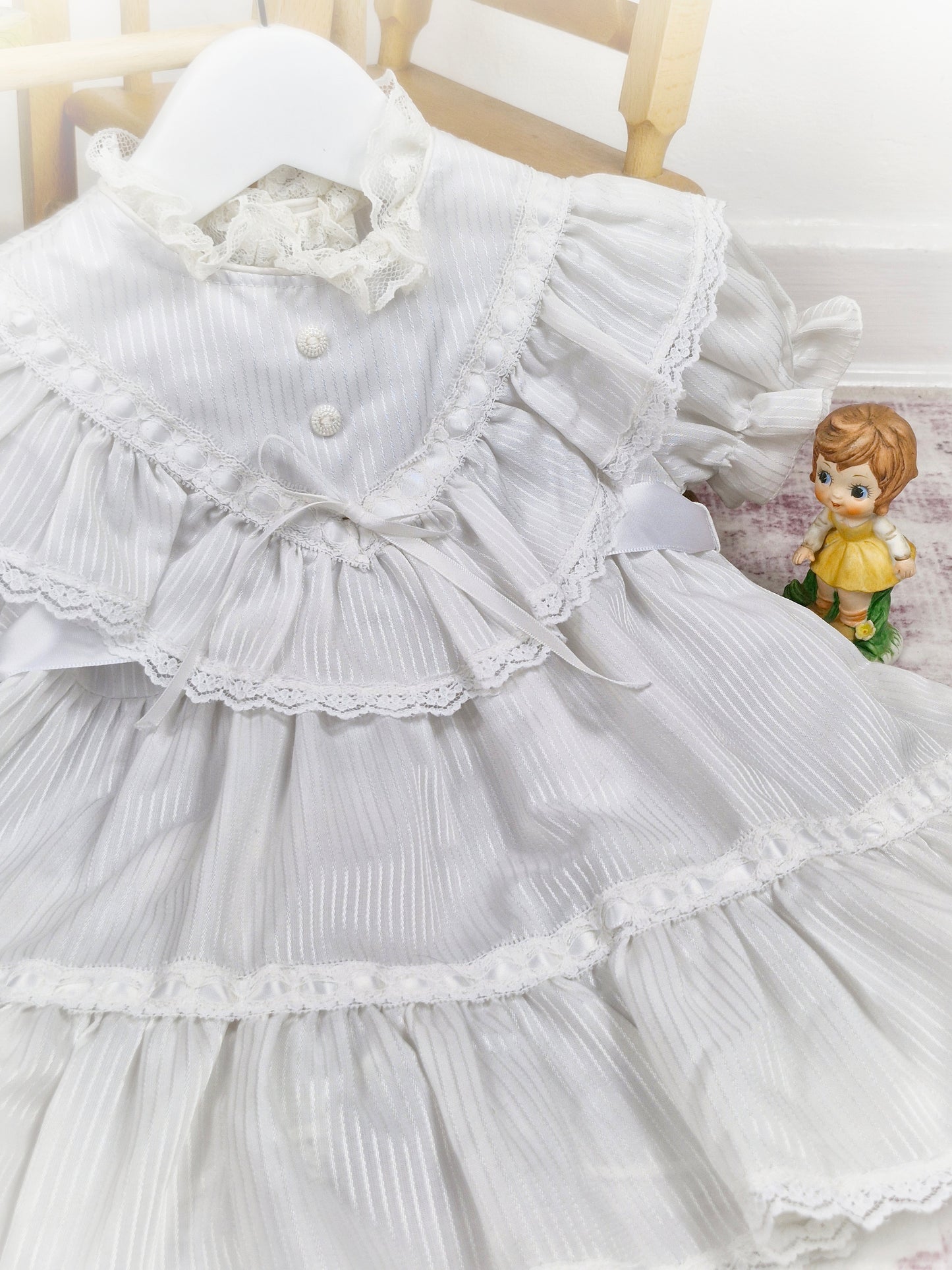2 years. White vintage dress with lace, ribbon and frills