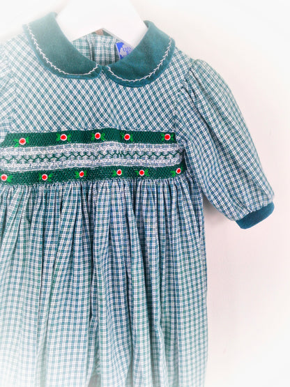 6-9 months. Green smocked romper by Carriage Boutique