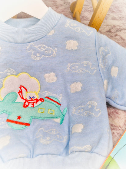 12-18 months. Blue vintage sweater from Cuties by Judy