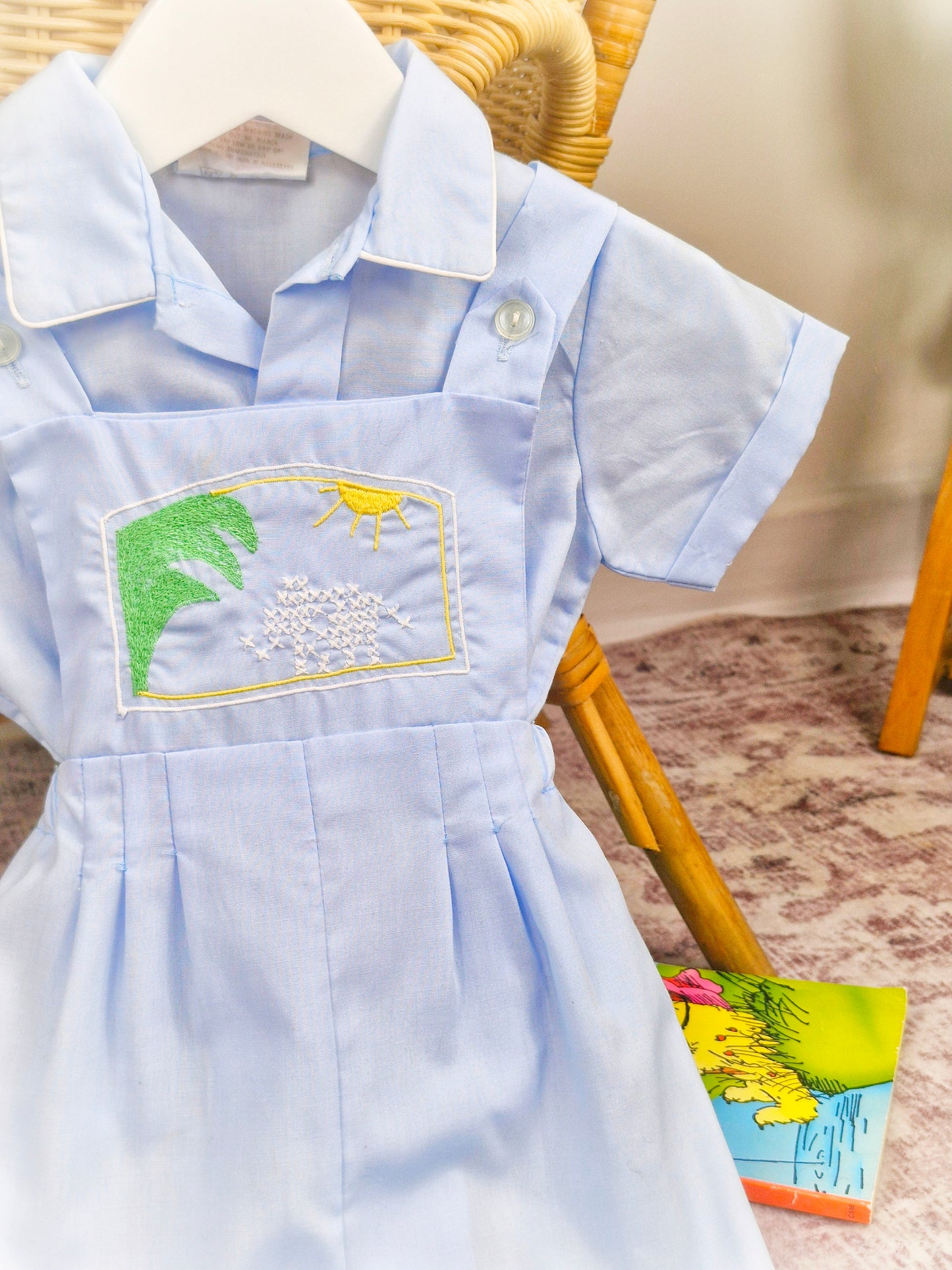 12-18 months. Blue two piece vintage set, shirt and dungarees embroidered design across chest
