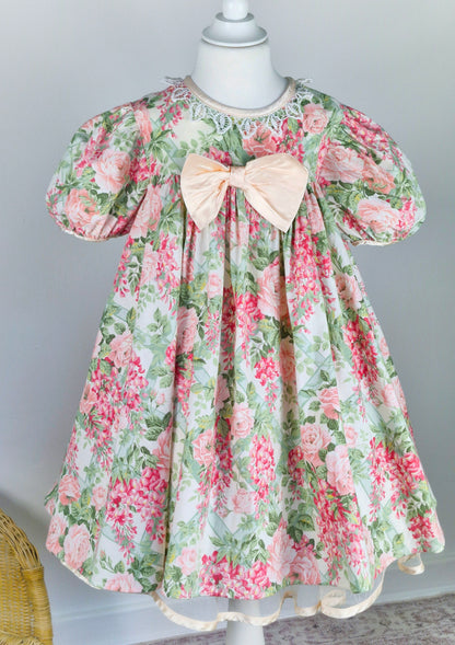 5 years. Vintage floral Bonnie Jean with large pink satin bow, puff sleeves and lace collar